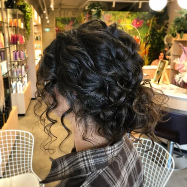 Dark Espresso Curly Messy Bun with Face-Framing Spirals