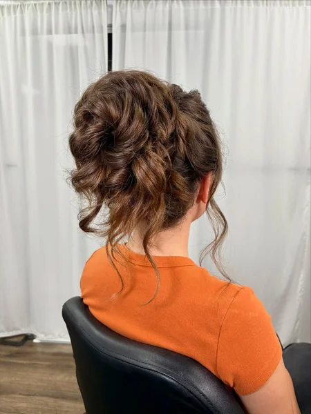 Dreamy Low Messy Bun with Soft Curtain Bangs