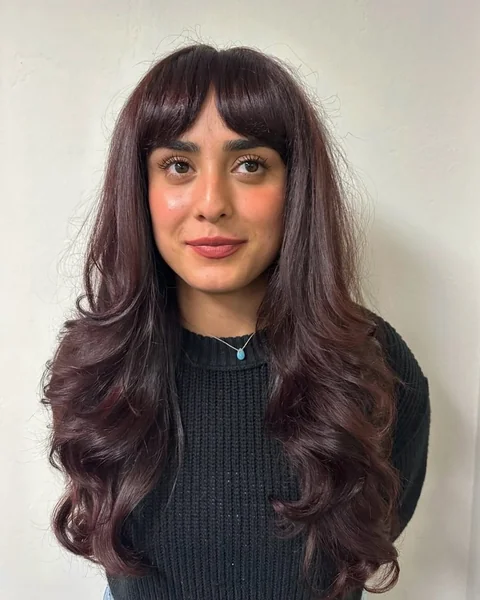 Edgy Jet Black Shag with Wispy Choppy Layers
