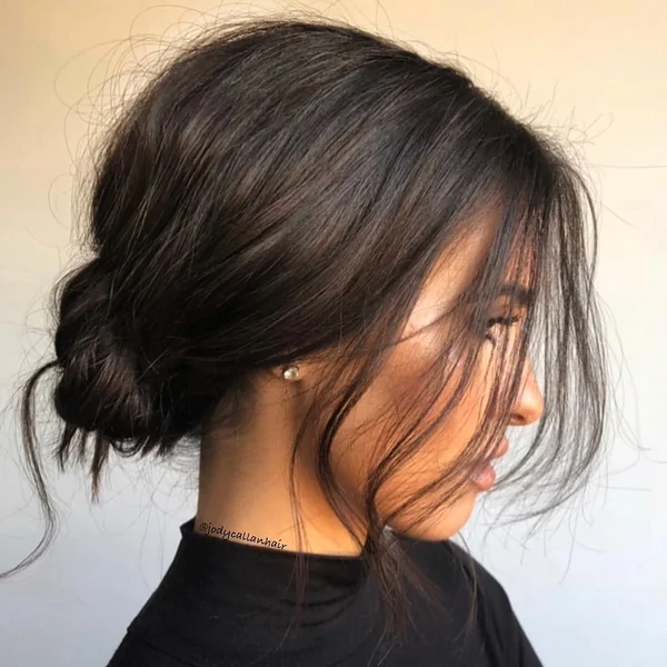 Effortless Dark Brunette Low Bun with Face-Framing Wisps