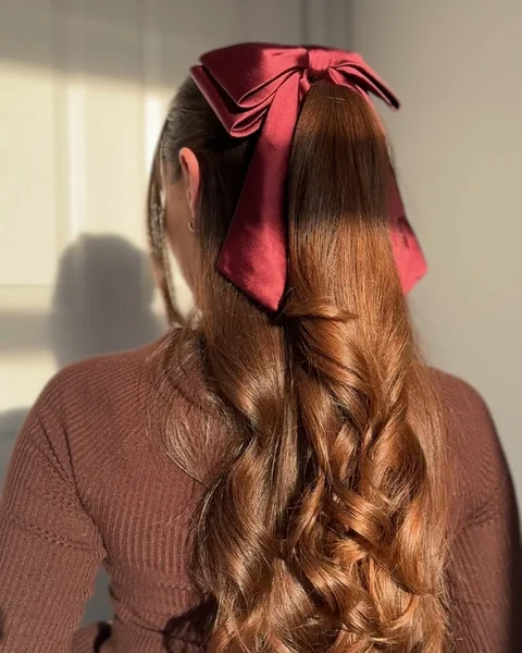 Elegant Copper Half-Updo with Romantic Ribbon Detail