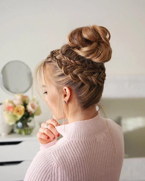 High-Volume Messy Braided Bun with Face-Framing Tendrils