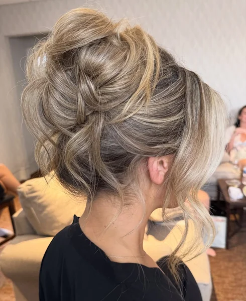 Intricate Floral-Pinned Updo for Natural Ringlets