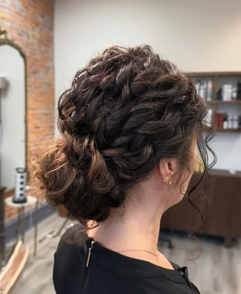 Intricate Sculpted Low Bun with Elegant Satin Floral Crown