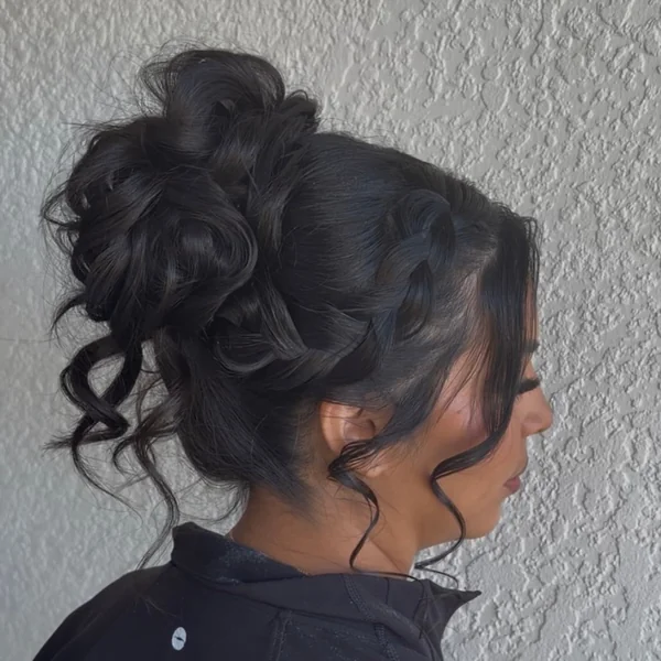 Messy Braided High Bun with Face-Framing Curls