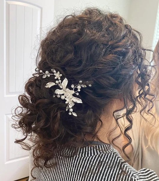 ntricate Floral-Pinned Updo for Tight Curls