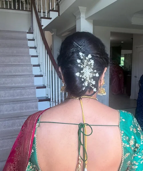 Polished French Twist with Sparkling Floral Accessory