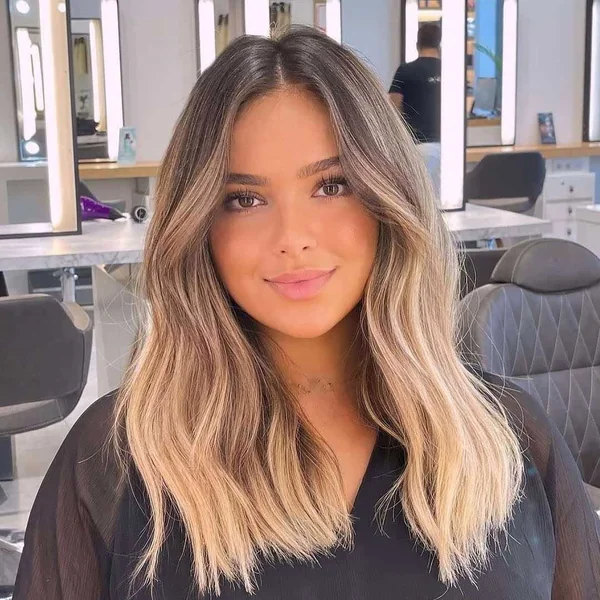Radiant Honey Blonde Balayage with Face-Framing Layers