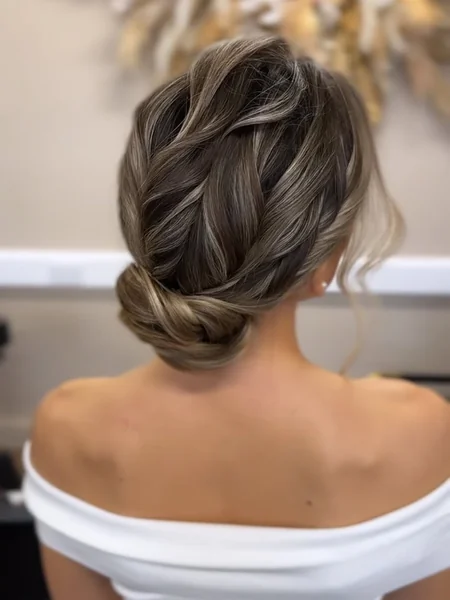 Romantic Textured Low Bun with Soft Dimensional Waves