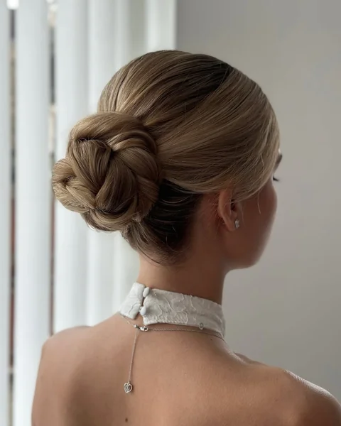 Sleek Blonde Knotted Bun with High Shine