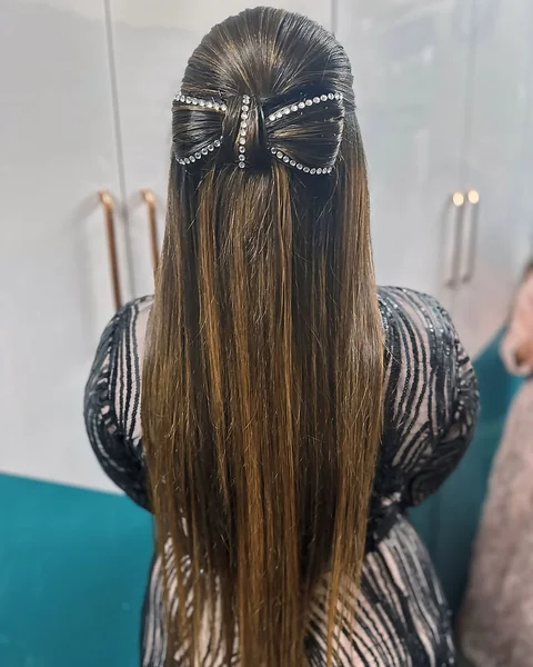 Sleek Half-Up Bow Style with Glitzy Rhinestone Accents
