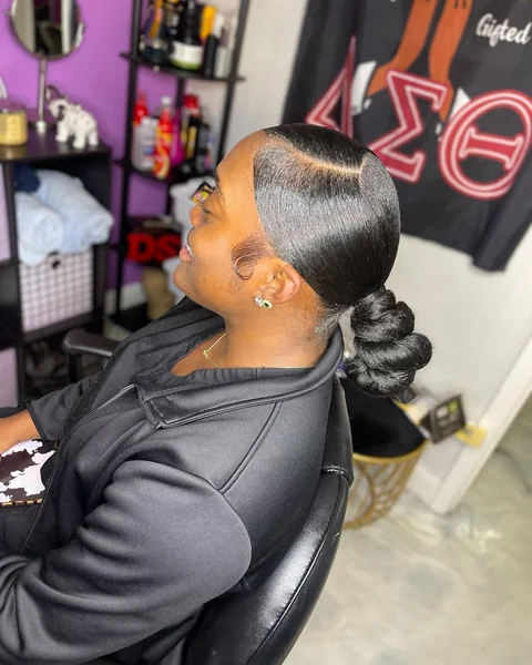 Sleek Low Bun with Polished Braided Knot