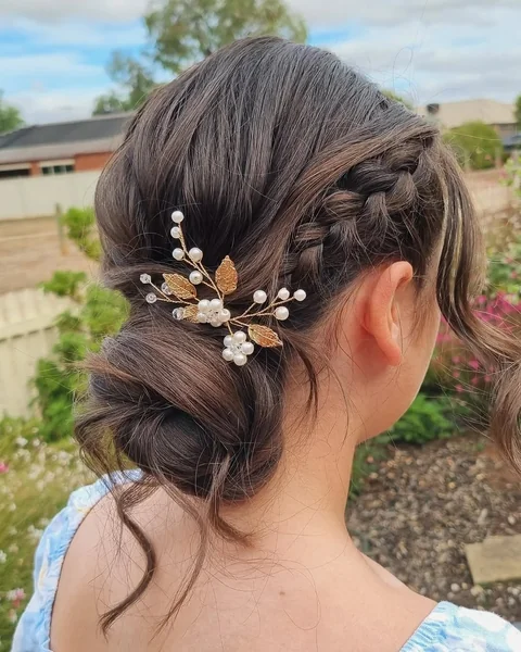 Sleek Low Chignon with Polished Mahogany Swirls