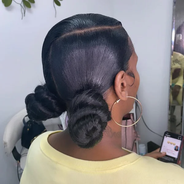 Sleek Low Space Buns with Polished Side Part