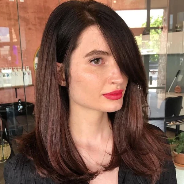 Sleek Mahogany Lob with Dramatic Side-Swept Bangs