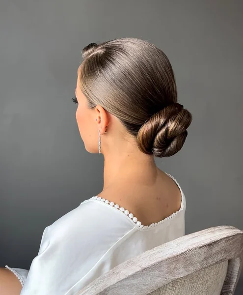 Sleek Polished Low Bun for Sophisticated Elegance