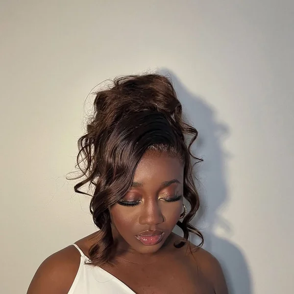 Soft Tucked Low Bun with Shimmering Pearl Pins