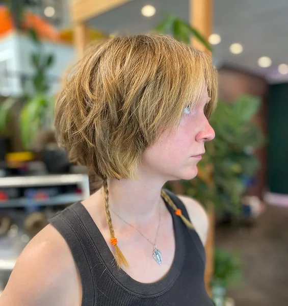 Textured Brunette Bob with Sun-Kissed Choppy Layers