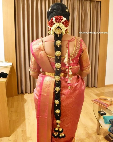 Traditional Indian Long Braid with Ornate Gold Jewelry