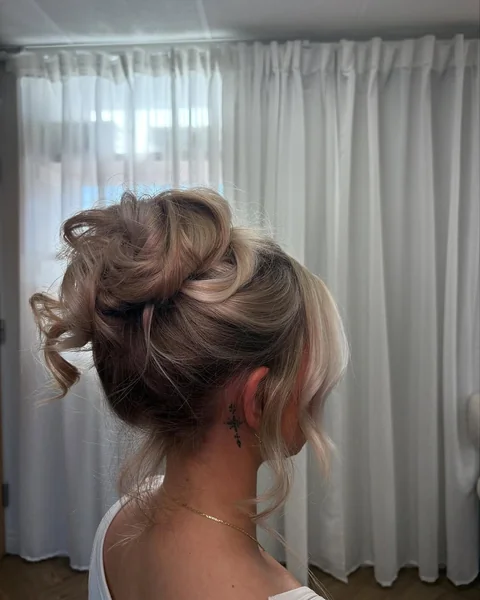Voluminous Center-Parted Messy Bun for Fine Hair