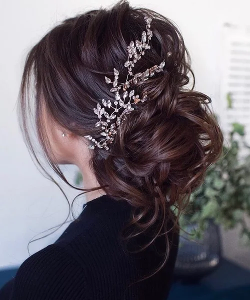 Voluminous Dark Brunette Messy Bun with Jeweled Accent