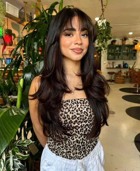 long layered haircuts with wispy bangs