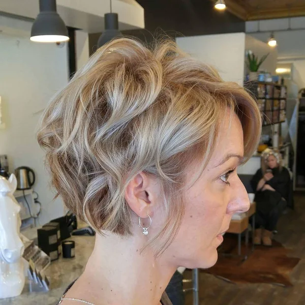 Wavy Honey Blonde Pixie with Side-Swept Volume