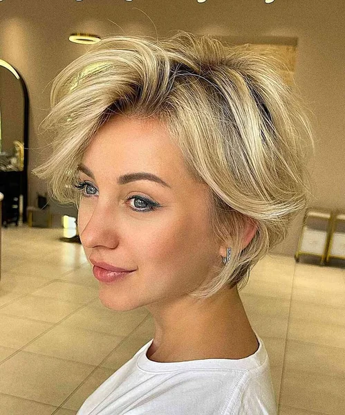 Wispy Platinum Blonde Pixie with Messy Volume