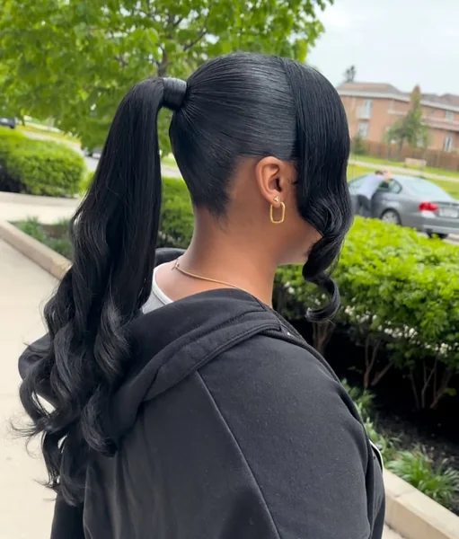 High Black Ponytail with Voluminous Swoop Bangs