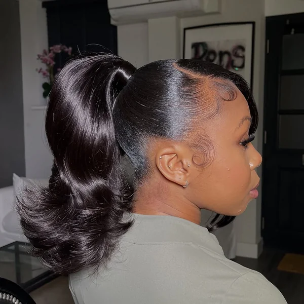 High Voluminous Dark Ponytail with Face-Framing Curl