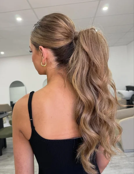 Retro Voluminous Blonde Ponytail with High Lift