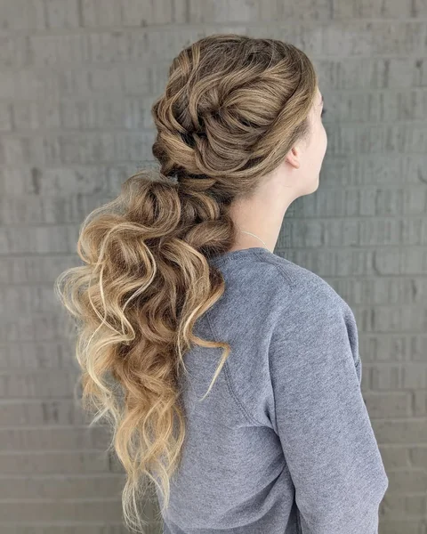 Sweeping Boho Braids into a Wavy Ponytail
