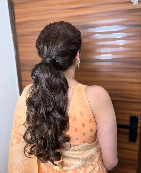 Voluminous Glossy Curls for Formal Ponytail