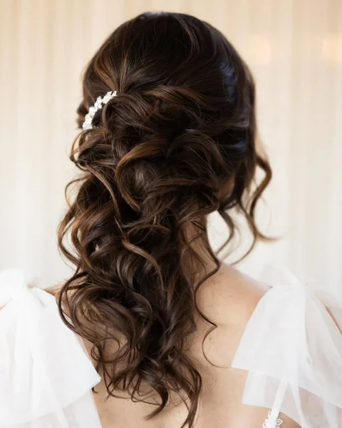 Voluminous Half-Up Curls with Elegant Bridal Clip