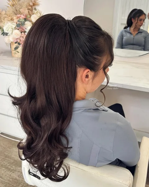 Voluminous Retro Black Ponytail with Curled Ends
