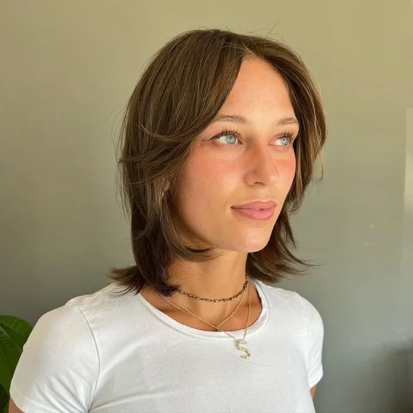Chic Brunette Wolf Cut with Face Taper