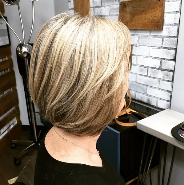 Chic Honey Blonde Feathered Stacked Bob