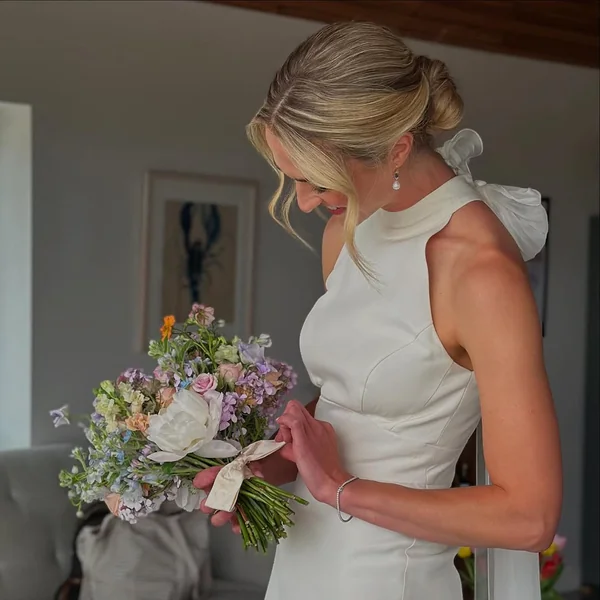 Chic Polished Low Bun with Elegant Curtain Bangs
