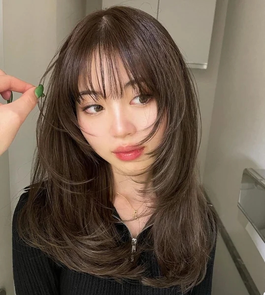 Enchanting Boho Updo with Soft Face-Framing Bangs