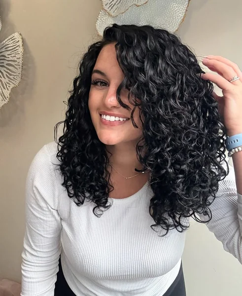 Glossy Midnight Curls with Deep Side Sweep
