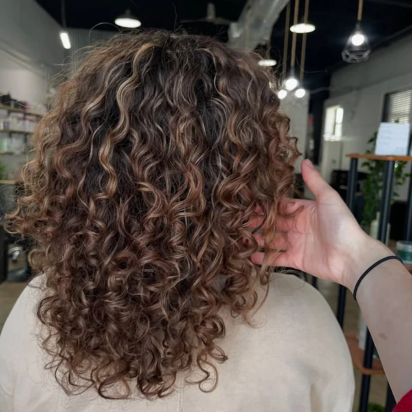 Glossy Midnight Ringlets with Deep Side Part