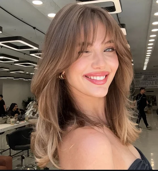 Honey-Toned Butterfly Cut with Breezy Curtain Bangs
