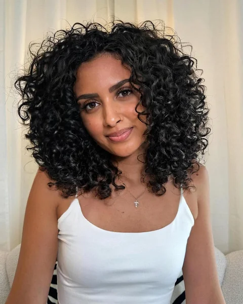 Professional Chic: Structured Curly Bob with Fringe