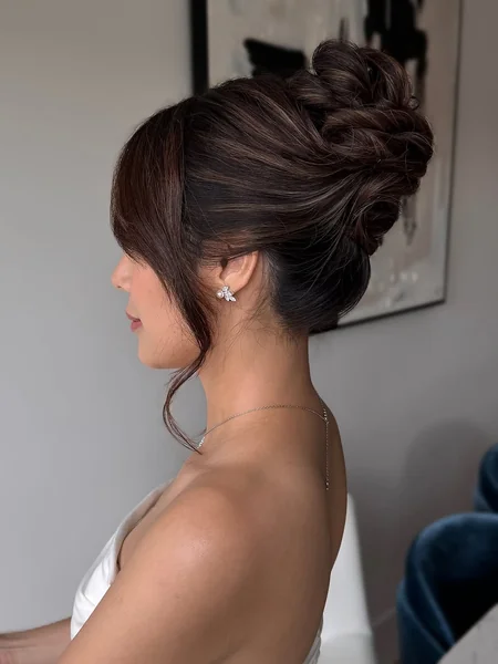 Sculpted High Chignon with Sweep Bangs