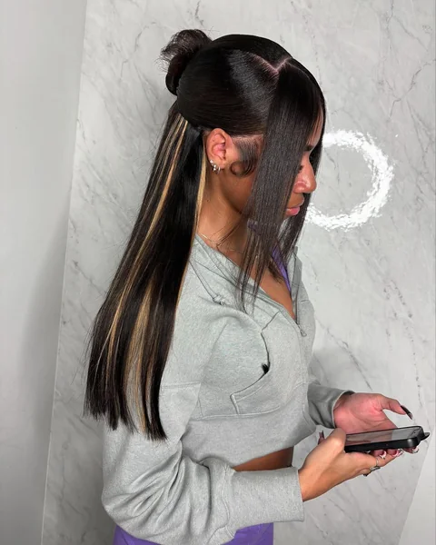 Sleek Half-Up Top Knot with Sharp Face-Framing Bangs