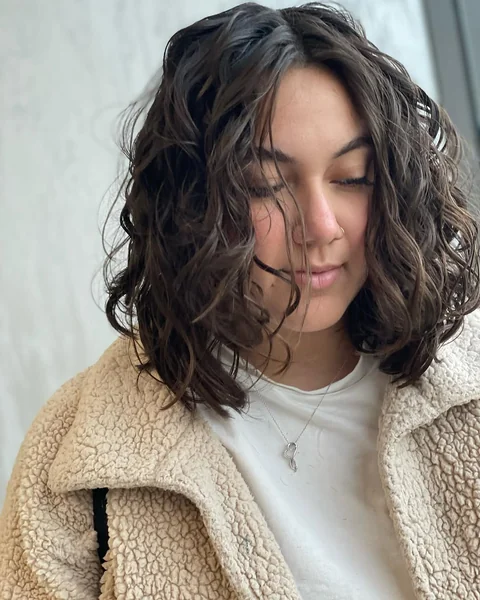 Soft Chocolate Lob with Relaxed Face-Framing Curls